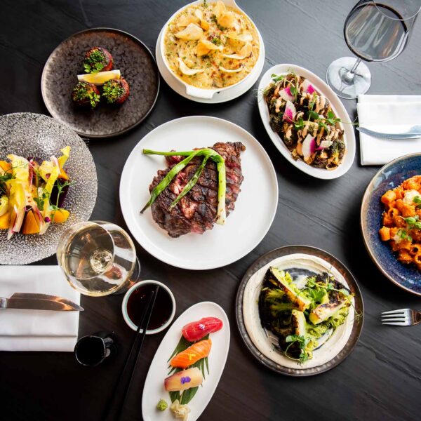 top down photo of multiple dishes from aera restaurant toronto