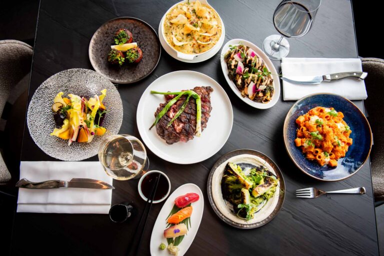 top down photo of multiple dishes from aera restaurant toronto